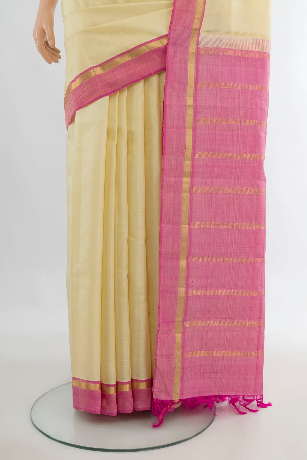 Pleats and pallu of Pure Silk Cream Kanjivaram Saree with Plain Body and Plain Border. 