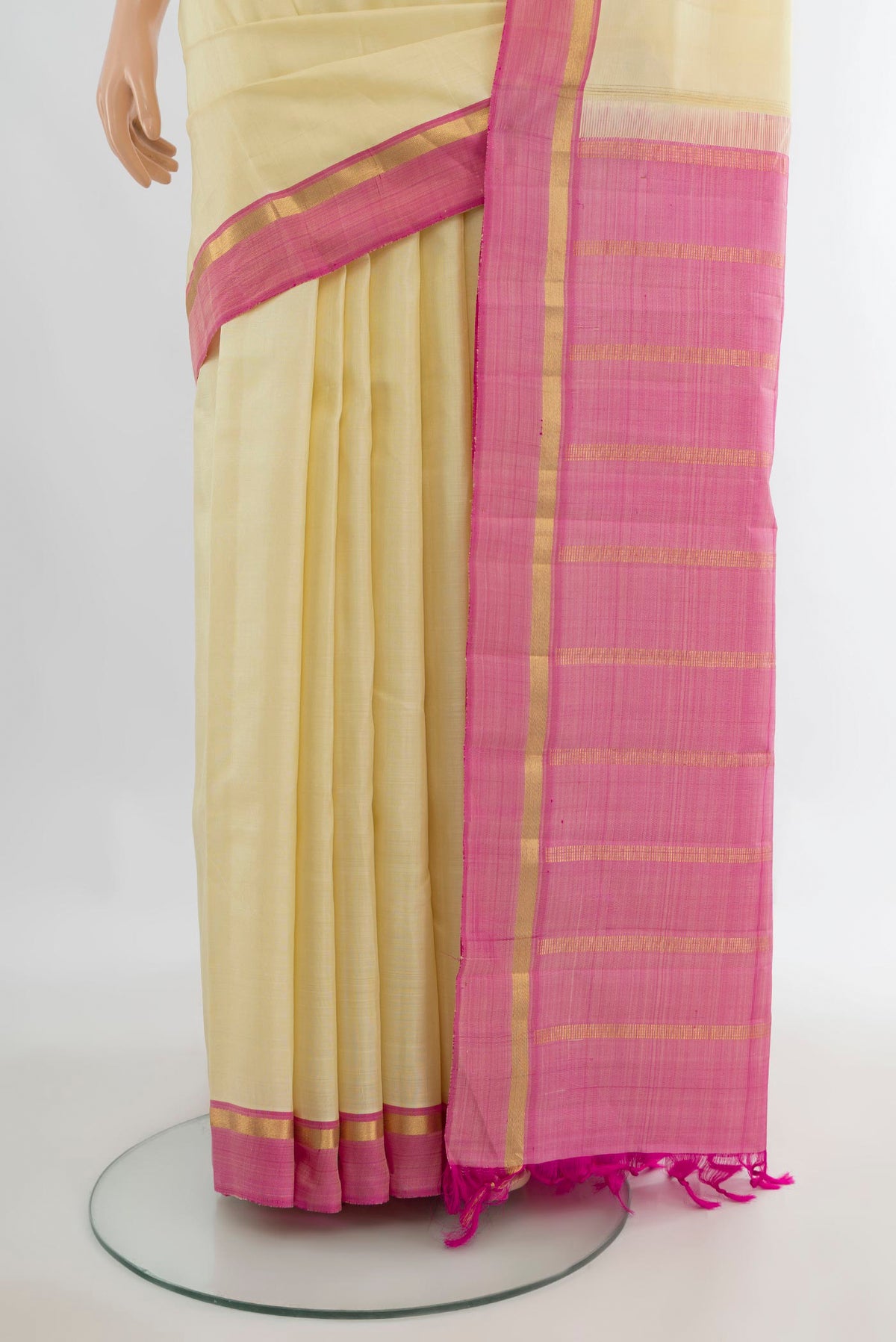 Pleats and pallu of Pure Silk Cream Kanjivaram Saree with Plain Body and Plain Border. 