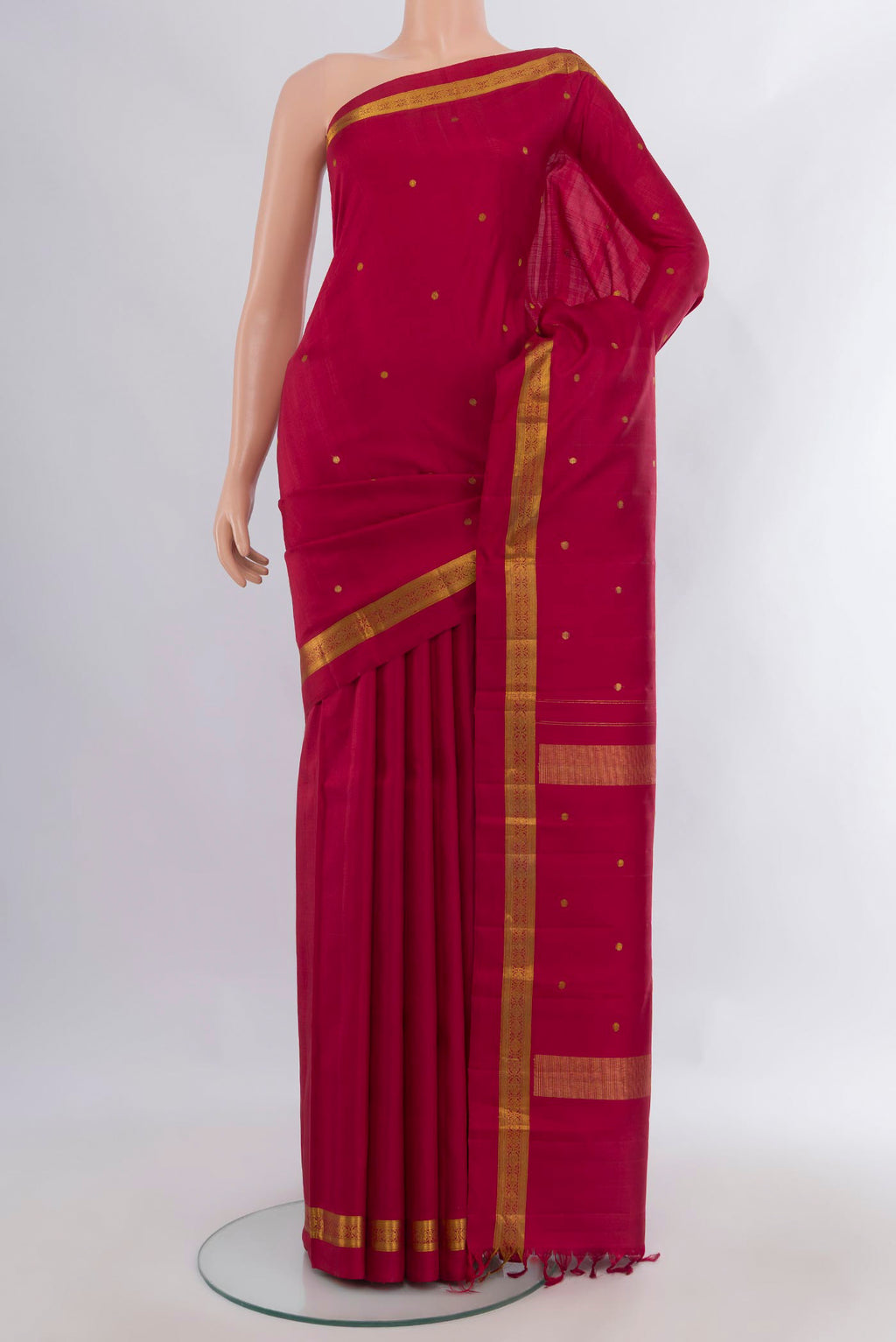 Pure Silk Red Kanjivaram Saree with Zari Butta on the body and Zari Border.  displayed on a mannequin