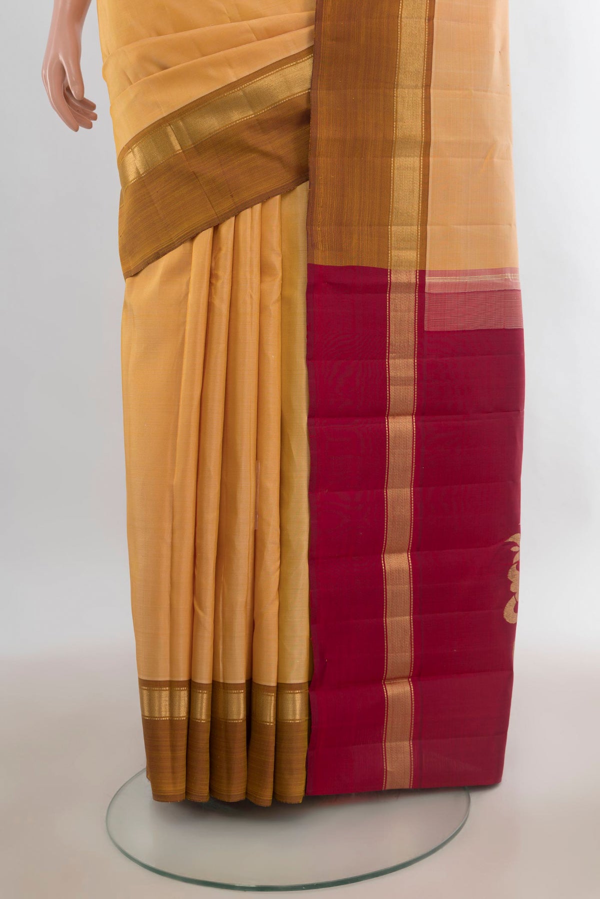 Pleats and pallu of Pure Silk Sandal Kanchipuram Saree with Plain Body and Plain Border. 