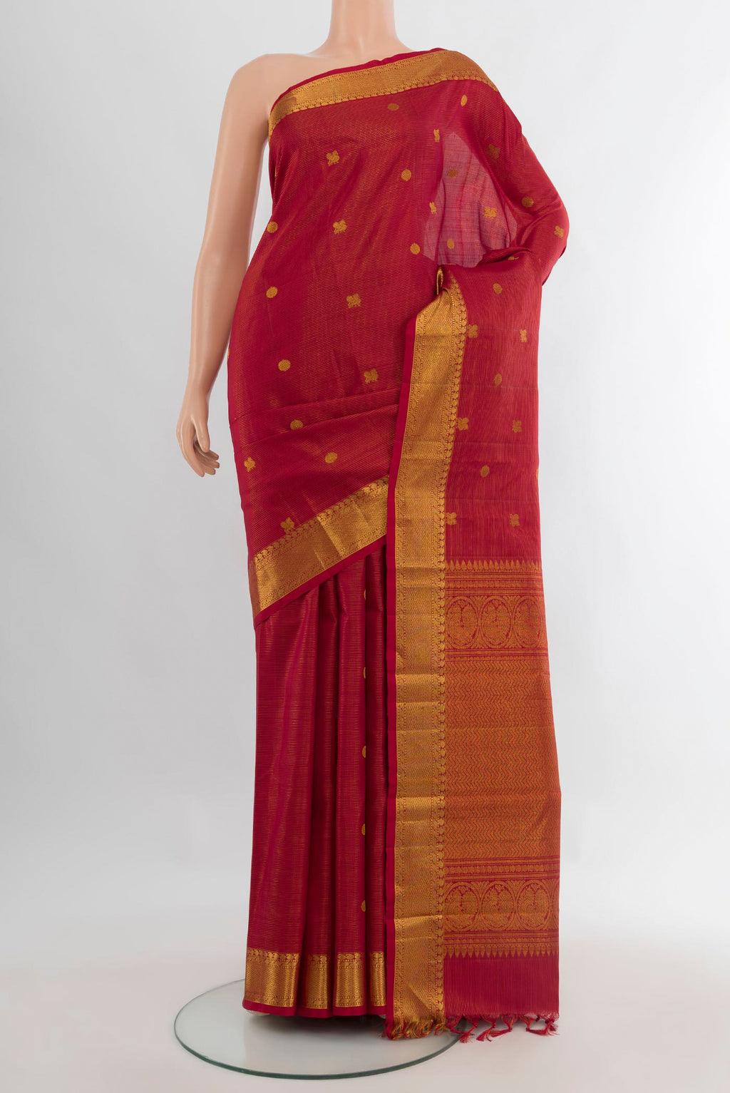 Pure Silk Maroon Kanjivaram Saree with Zari Butta on the body and Zari Border.  displayed on a mannequin