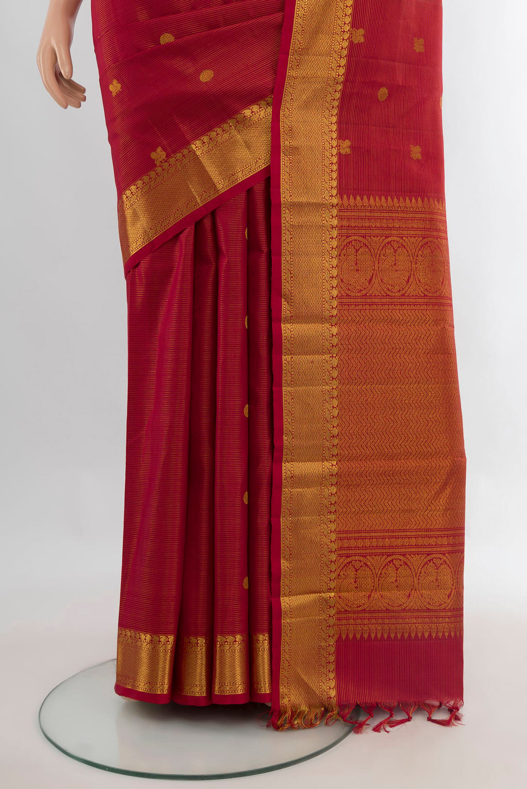 Pleats and pallu of Pure Silk Maroon Kanjivaram Saree with Zari Butta on the body and Zari Border. 