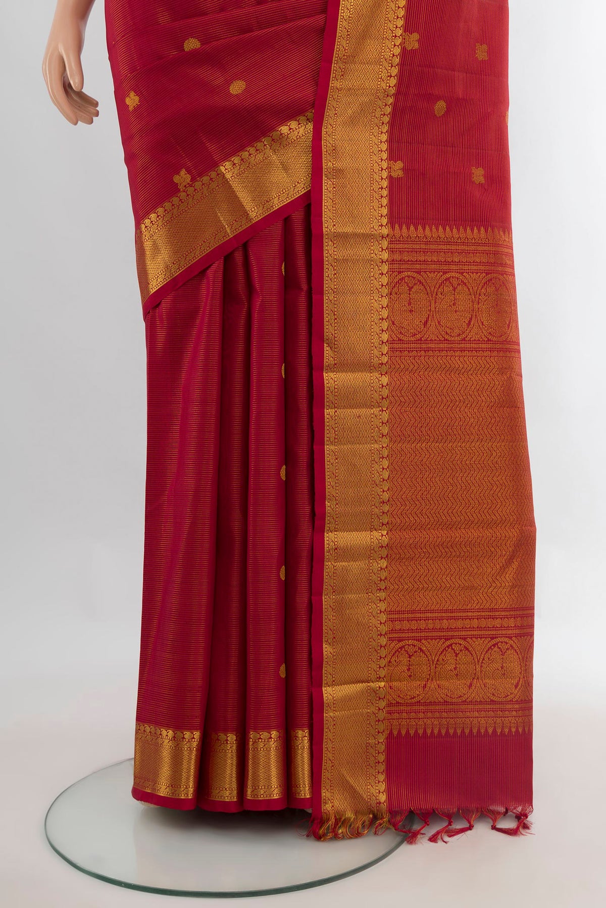 Pleats and pallu of Pure Silk Maroon Kanjivaram Saree with Zari Butta on the body and Zari Border. 