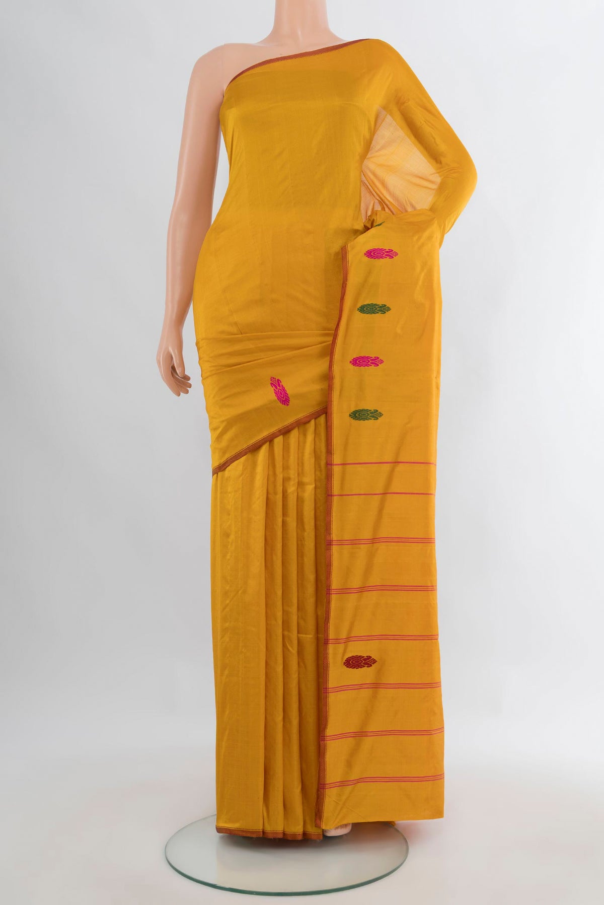 Pure Silk Mustard Kanchipuram Saree with Plain Body and Thread Border.  displayed on a mannequin