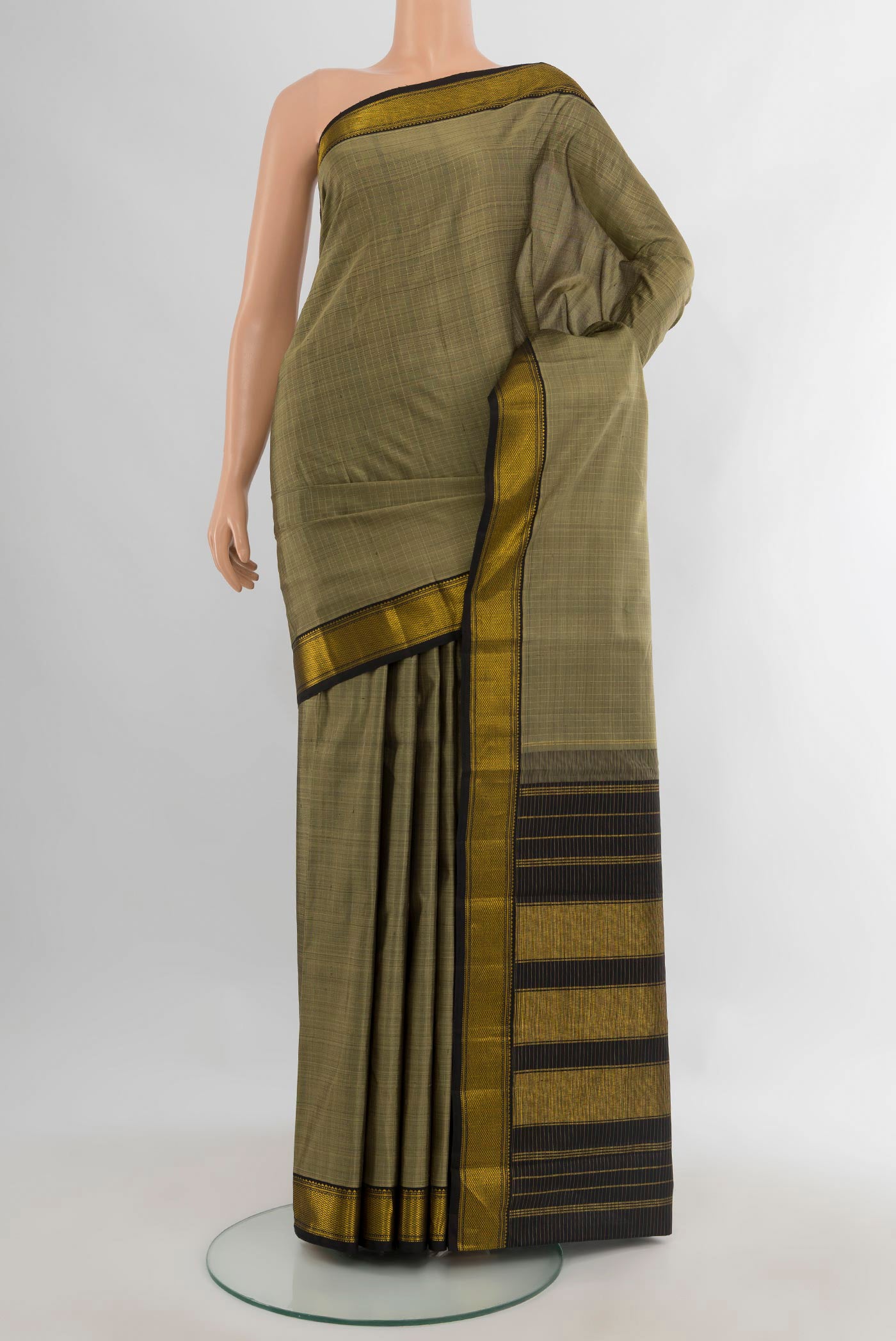 Pure Silk Grey Kanjivaram Saree with Plain Body and Zari Border.  displayed on a mannequin