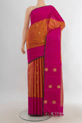 Pure Silk Pure Zari Golden Peach Kanjivaram Saree with Zari Butta on the body and Silk Border.  displayed on a mannequin