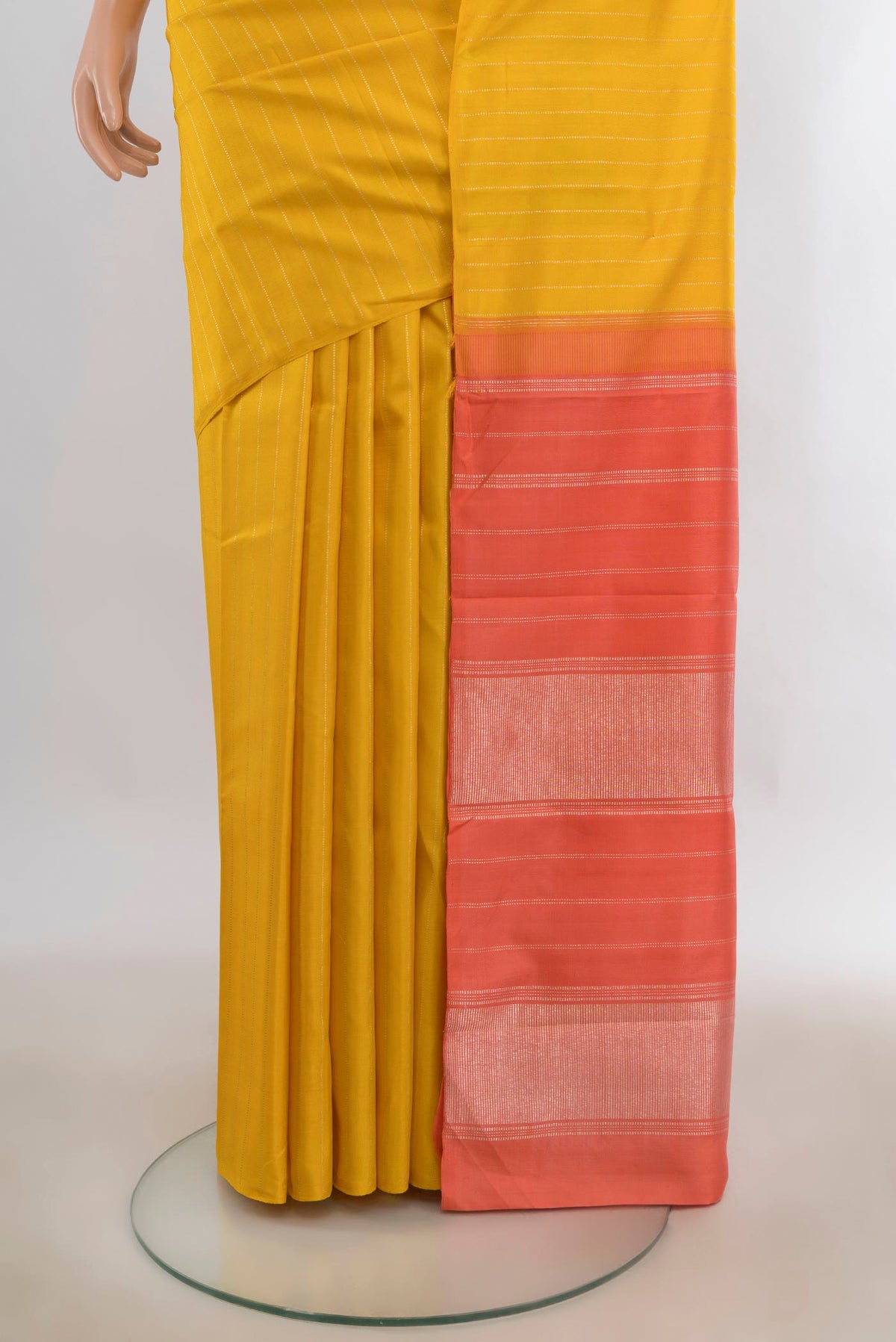 Pleats and pallu of Pure Silk Yellow Kanjivaram Saree with Stripes on the body and Without Border. 