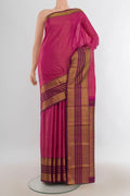 Pure Silk Magenta Kanjivaram Saree with Plain Body and Silk Border.  displayed on a mannequin