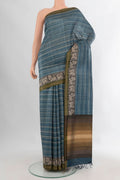 Blue Tussar Saree with Printed design on the body and Zari Border.  displayed on a mannequin