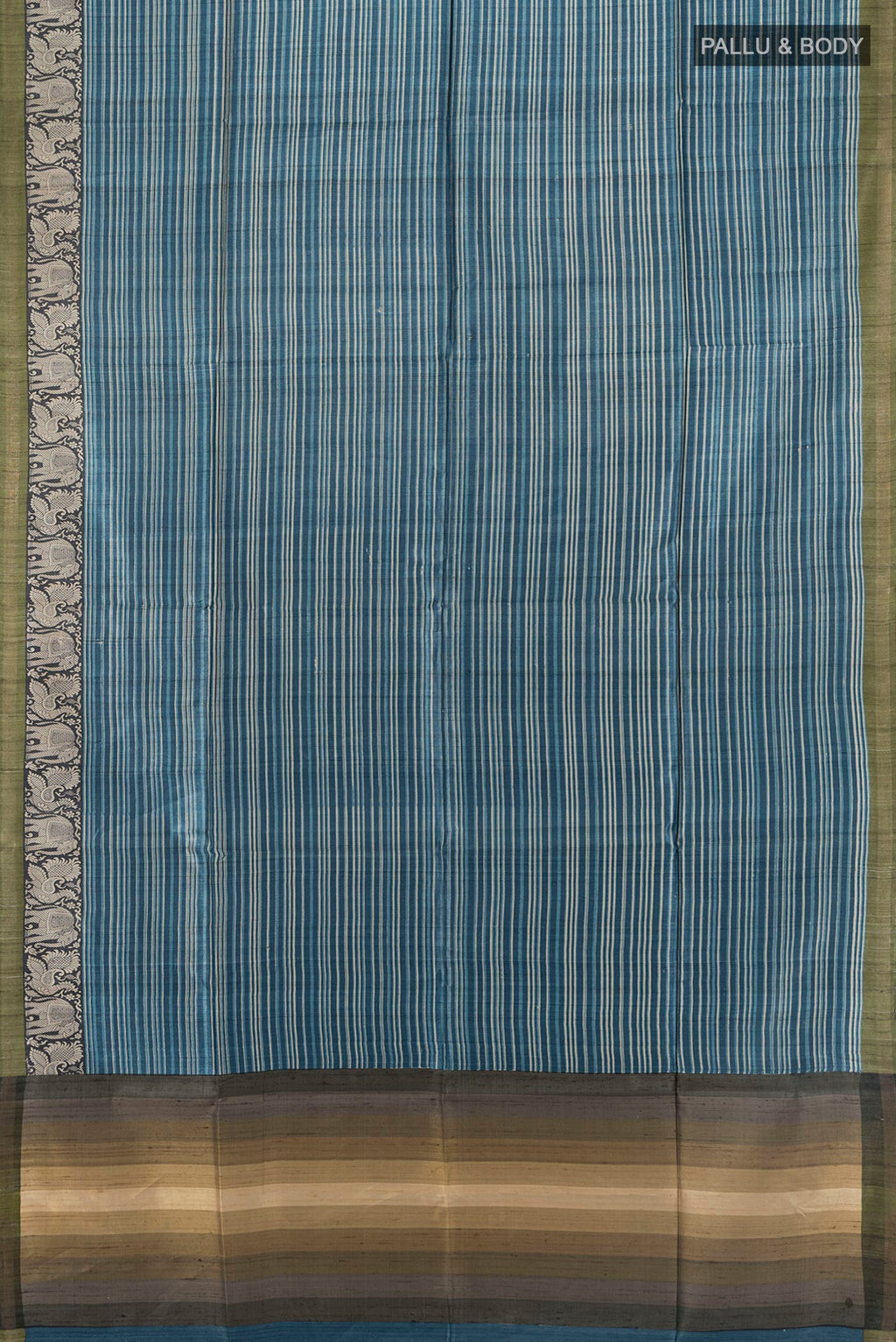 Flat view of Blue Tussar Saree with Printed design on the body and Zari Border. 