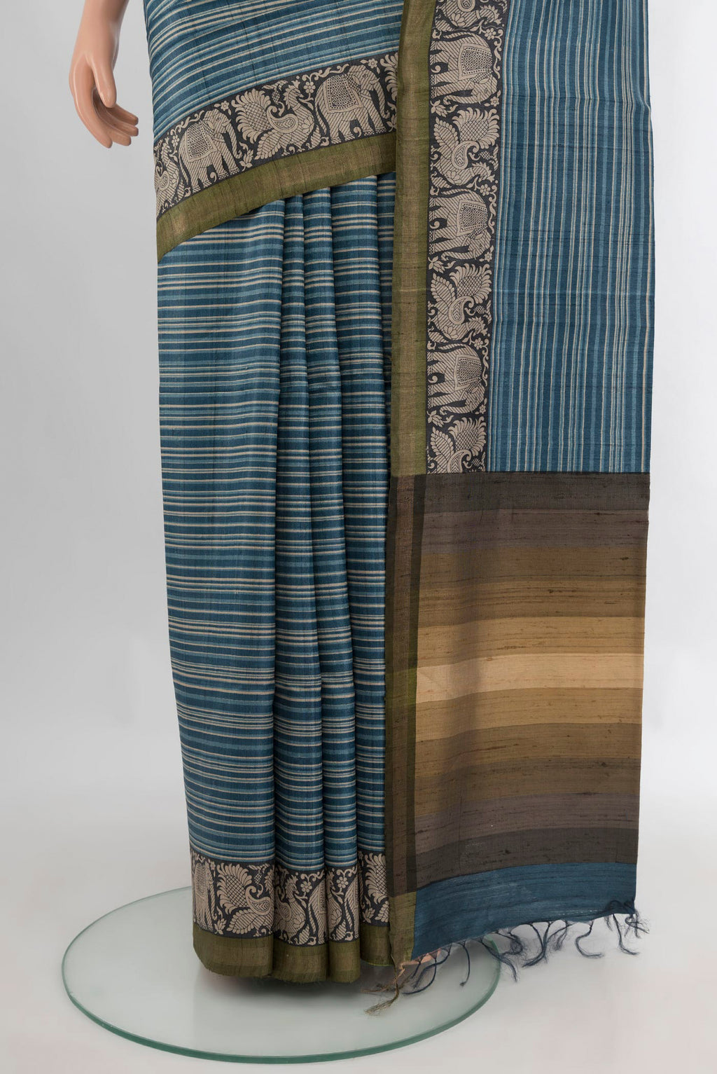 Pleats and pallu of Blue Tussar Saree with Printed design on the body and Zari Border. 