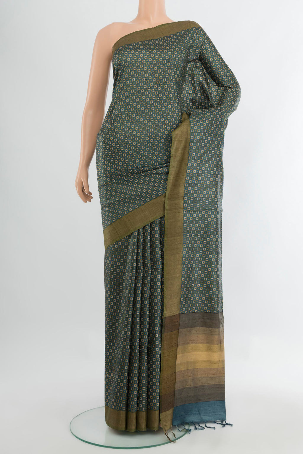 Multi Color Tussar Silk Saree with Floral Print on the body and Silk Border.  displayed on a mannequin