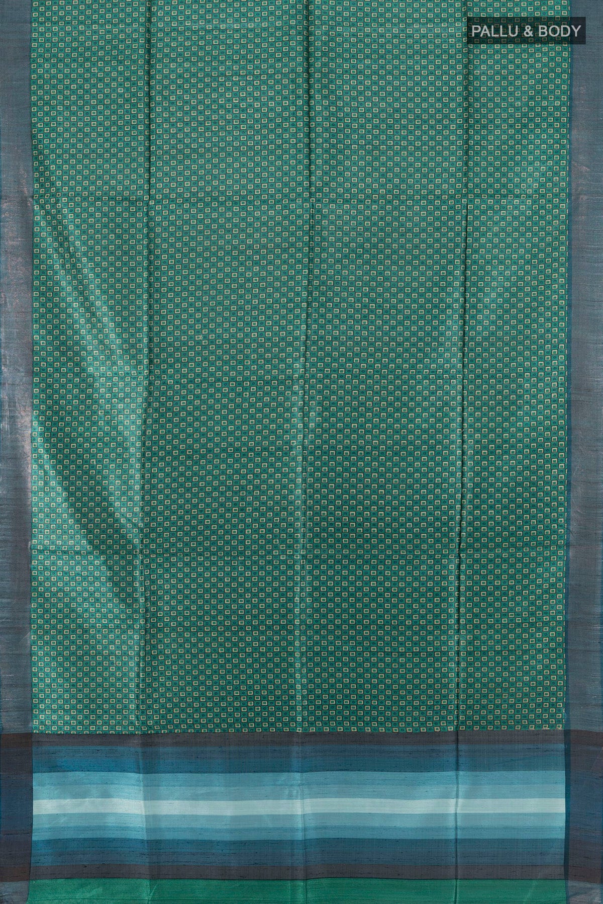 Flat view of Green Tussar Saree with Printed design on the body and Zari Border. 