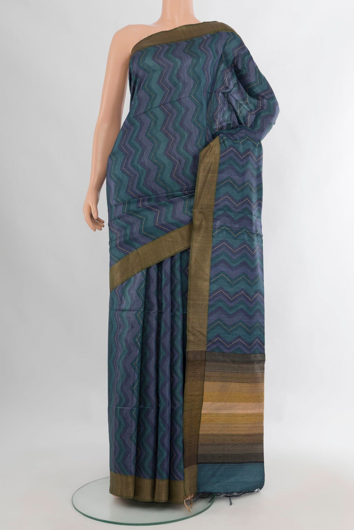 Multi Color Tussar Saree with Printed design on the body and Zari Border.  displayed on a mannequin