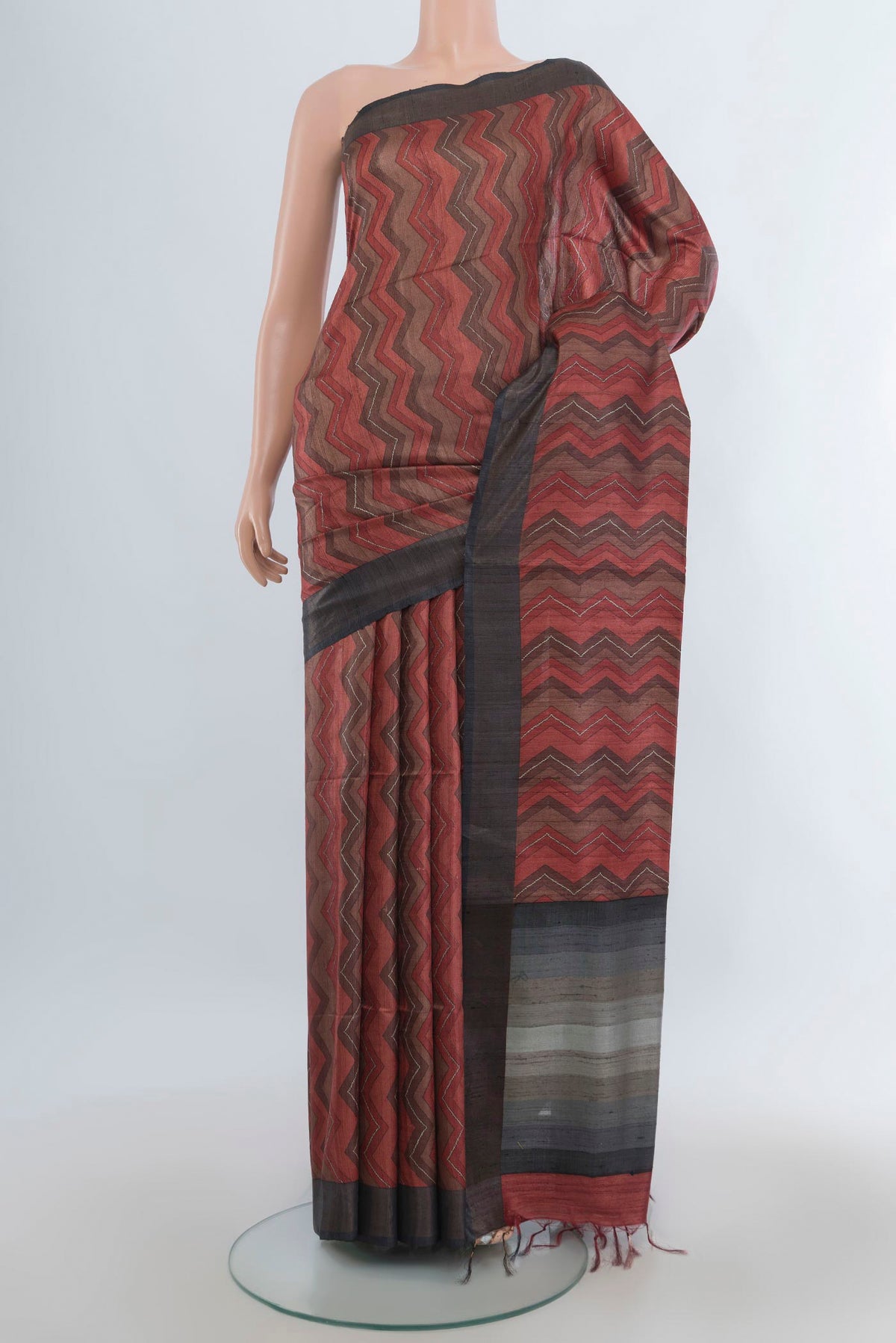 Multi Color Tussar Saree with Floral Print on the body and Zari Border.  displayed on a mannequin