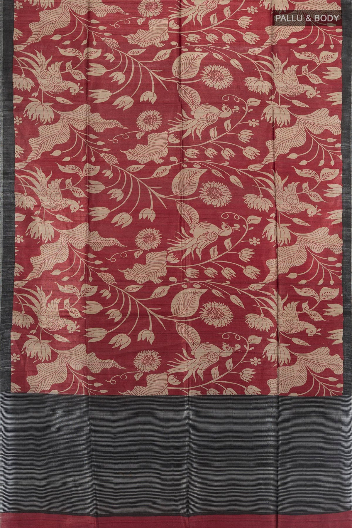 Flat view of Maroon Tussar Saree with Floral Print on the body and Zari Border. 