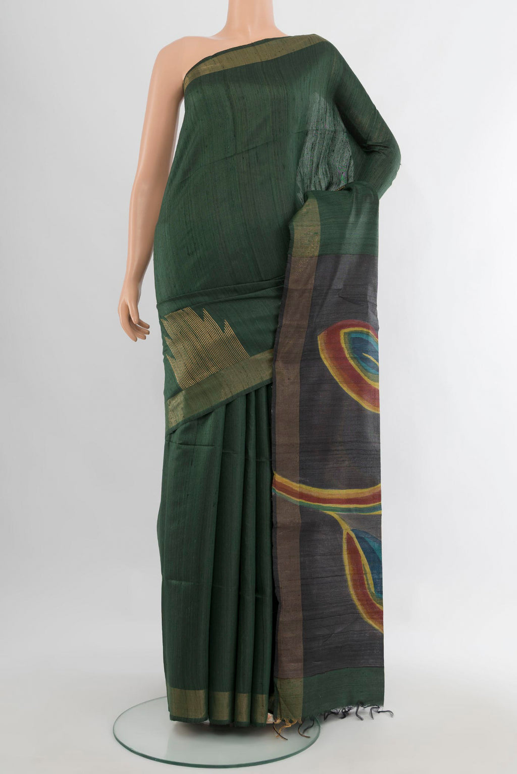 Pure Silk Bottle Green Tussar Saree with Floral Print on the body and Zari Border.  displayed on a mannequin