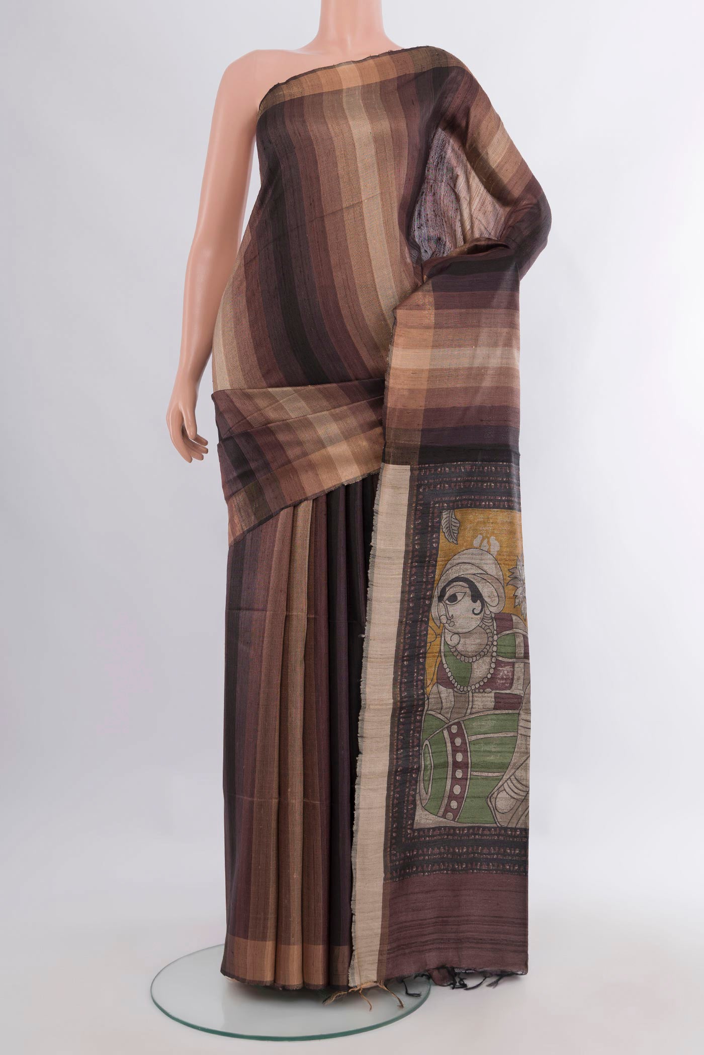 Brown Tussar Saree with Stripes on the body and Zari Border.  displayed on a mannequin