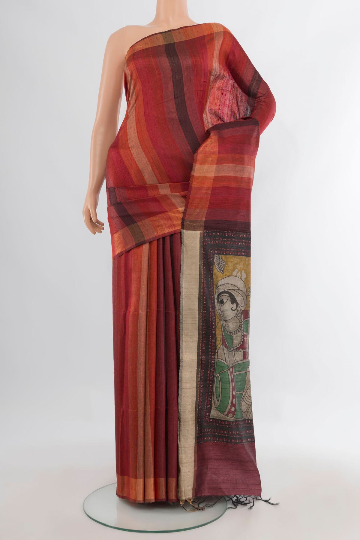 Multi Color Tussar Saree with Stripes on the body and Zari Border.  displayed on a mannequin