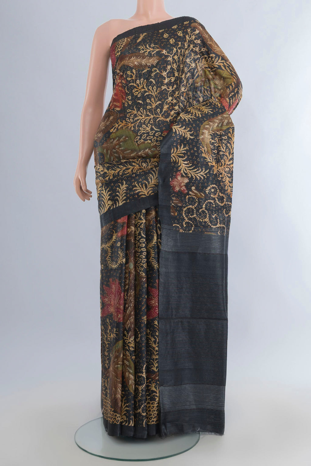Bottle Green Tussar Saree with Floral Print on the body and Plain Border.  displayed on a mannequin