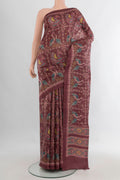 Brown Tussar Saree with Floral Print on the body and Printed Border.  displayed on a mannequin