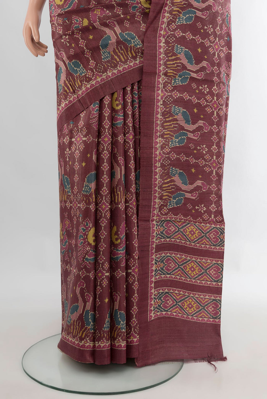 Pleats and pallu of Brown Tussar Saree with Floral Print on the body and Printed Border. 