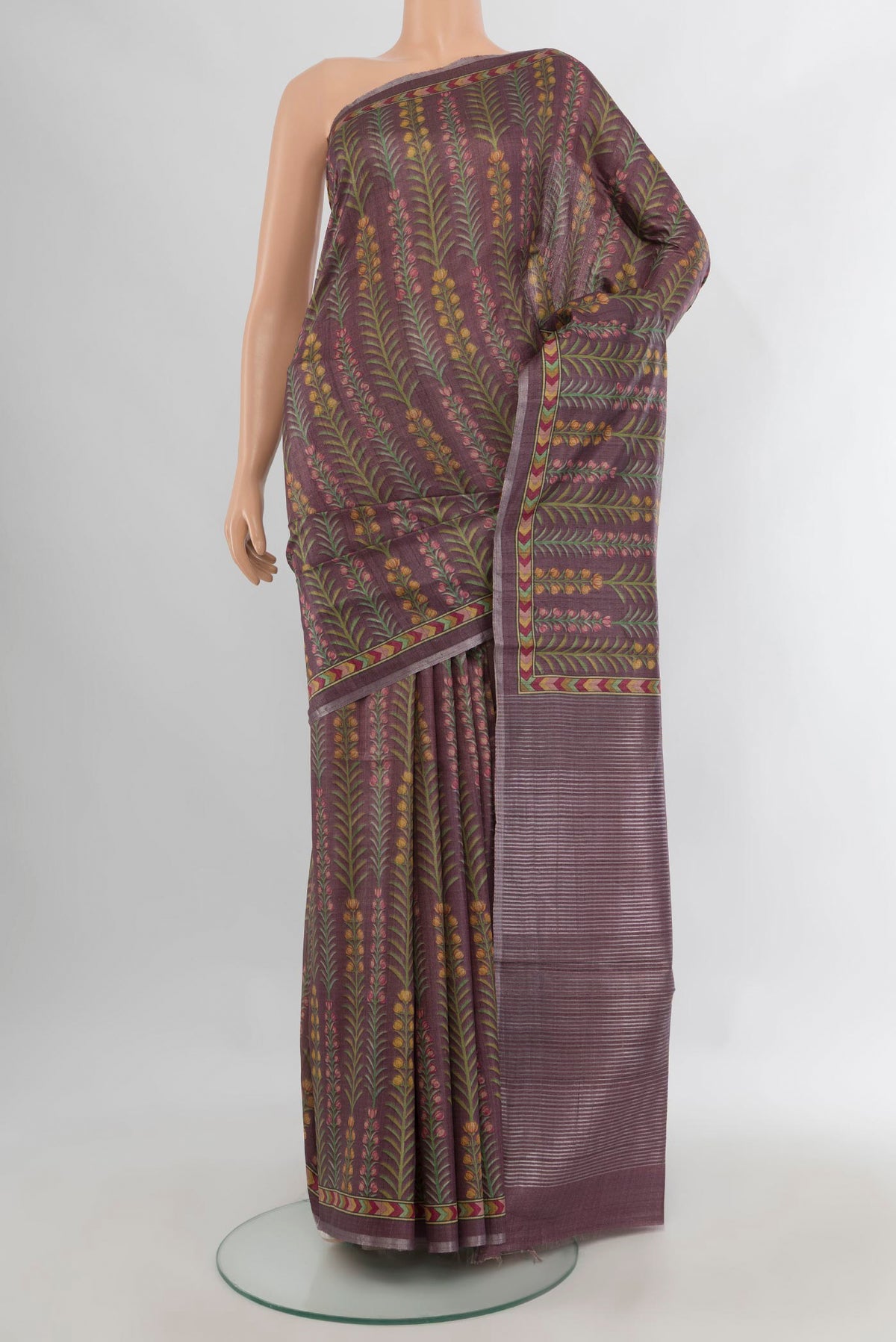 Mauve Tussar Saree with Printed design on the body and Printed Border.  displayed on a mannequin