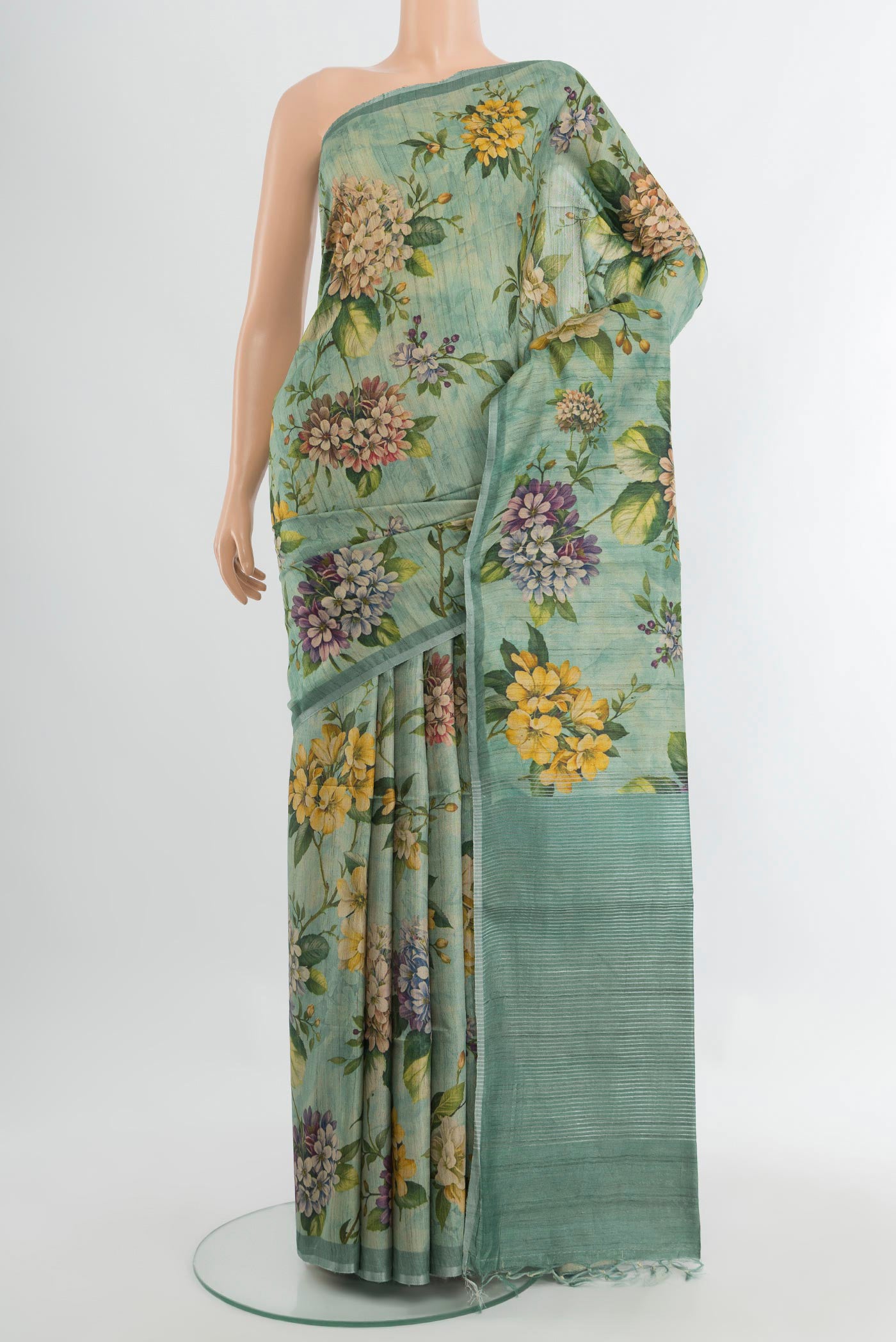 Multi Color Tussar Silk Saree with Floral Print on the body and Silk Border.  displayed on a mannequin