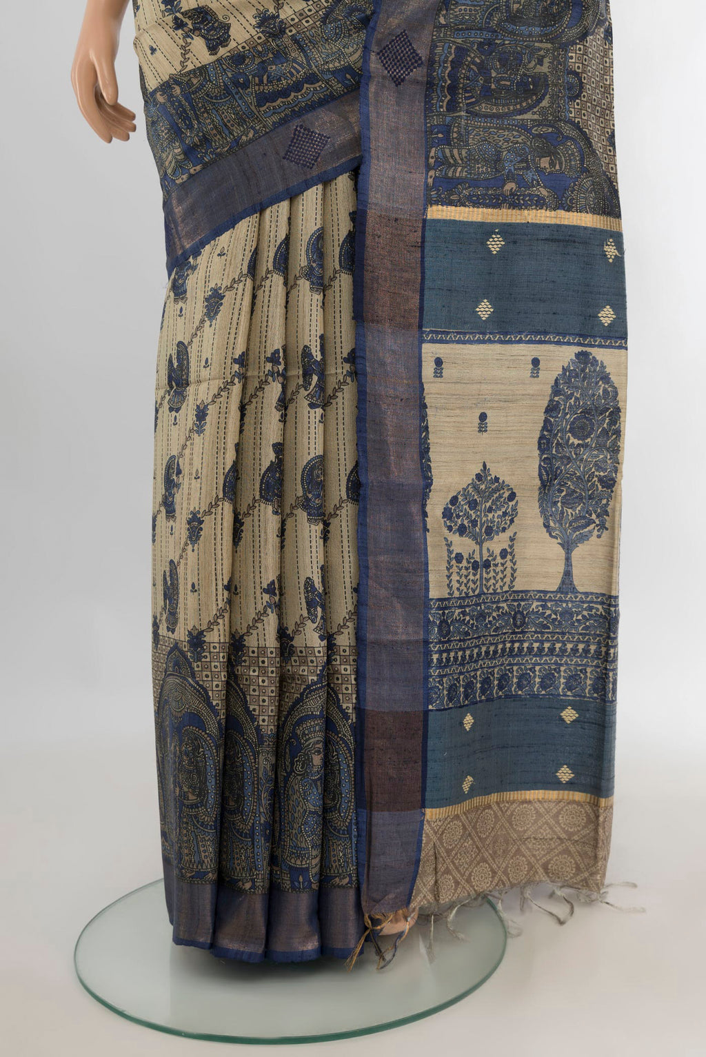 Pleats and pallu of Beige Tussar Saree with Floral Print on the body and Zari Border. 