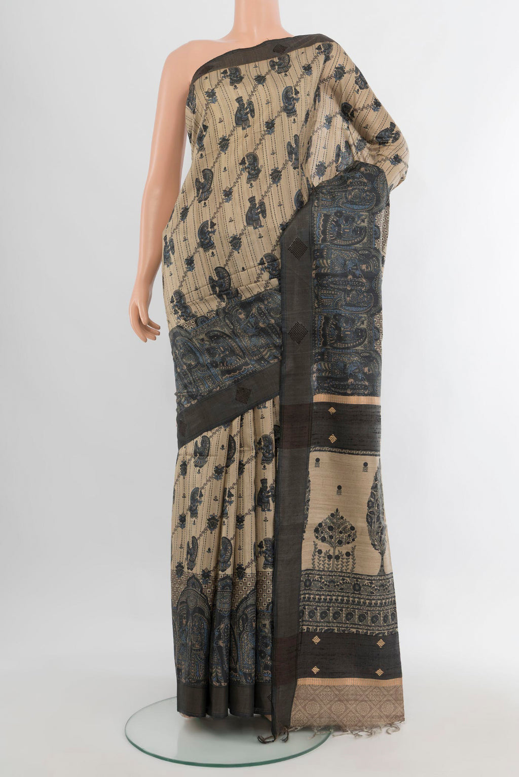 Pure Silk Beige Tussar Saree with Embroidery on the body and Zari Border.  displayed on a mannequin