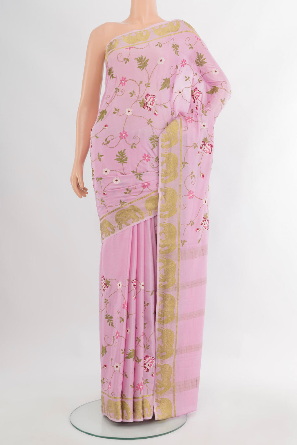 Rose pink Mysore Crepe Saree with Embroidery on the body and Zari Border.  displayed on a mannequin
