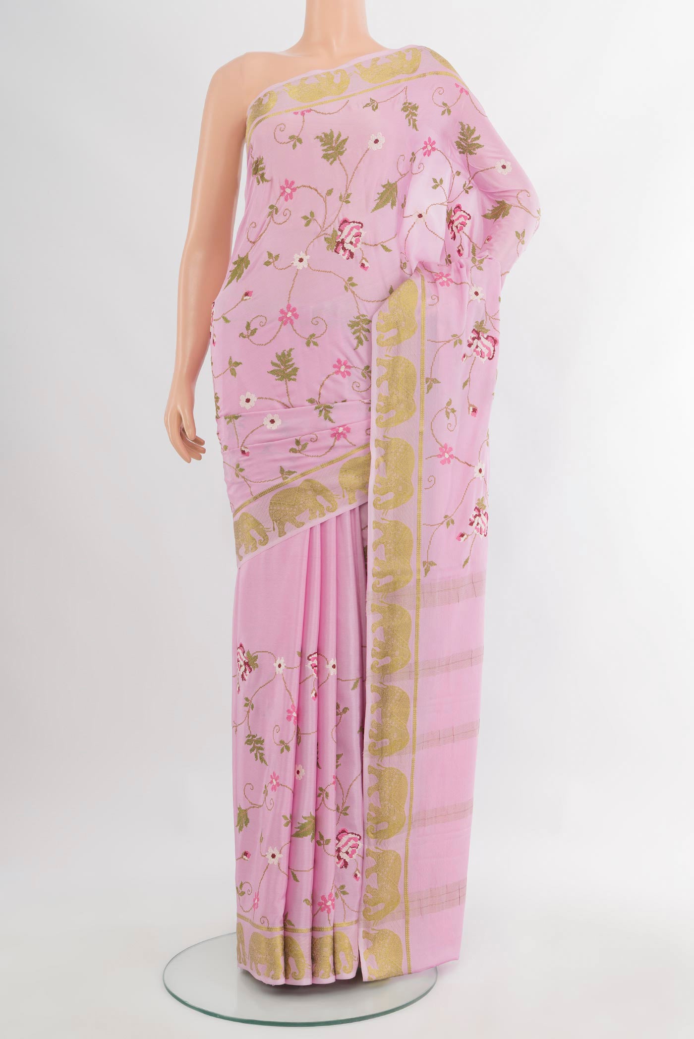 Rose pink Mysore Crepe Saree with Embroidery on the body and Zari Border.  displayed on a mannequin