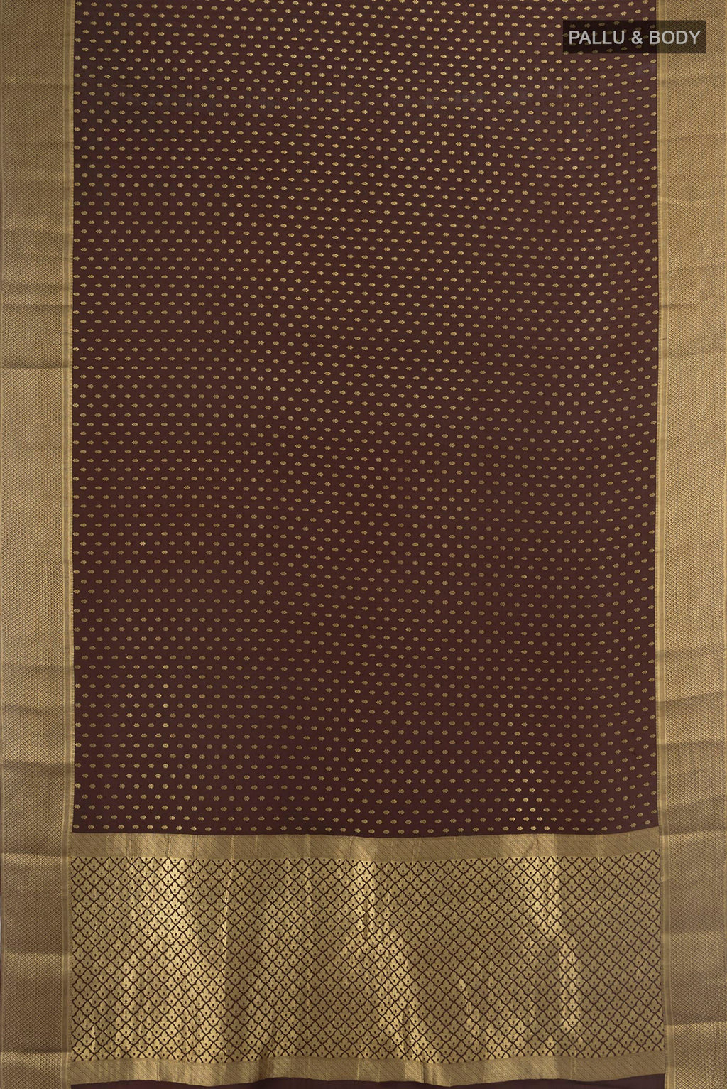 Flat view of Coffee Brown Mysore Crepe Saree with Zari Butta on the body and Zari Border. 