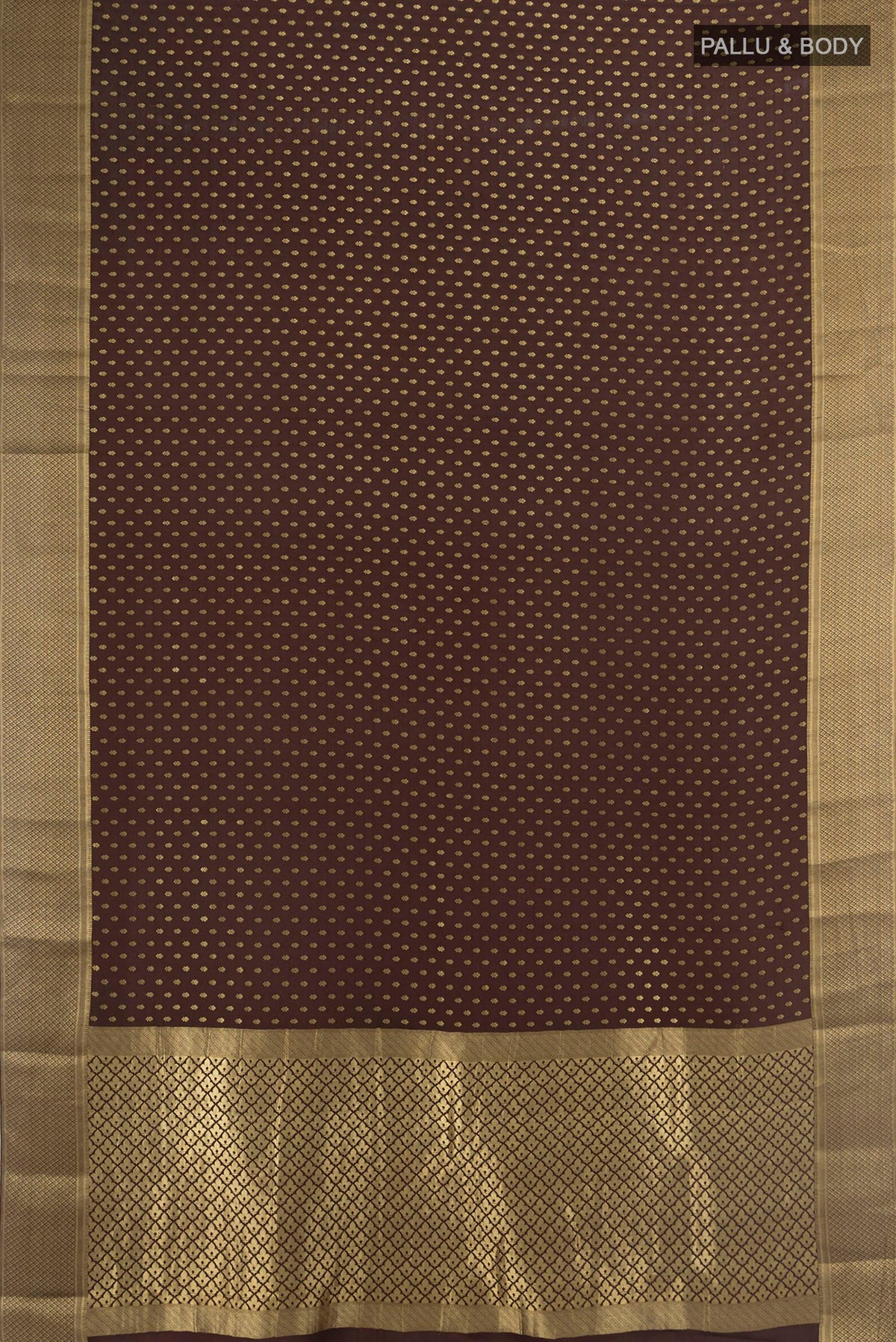 Flat view of Coffee Brown Mysore Crepe Saree with Zari Butta on the body and Zari Border. 