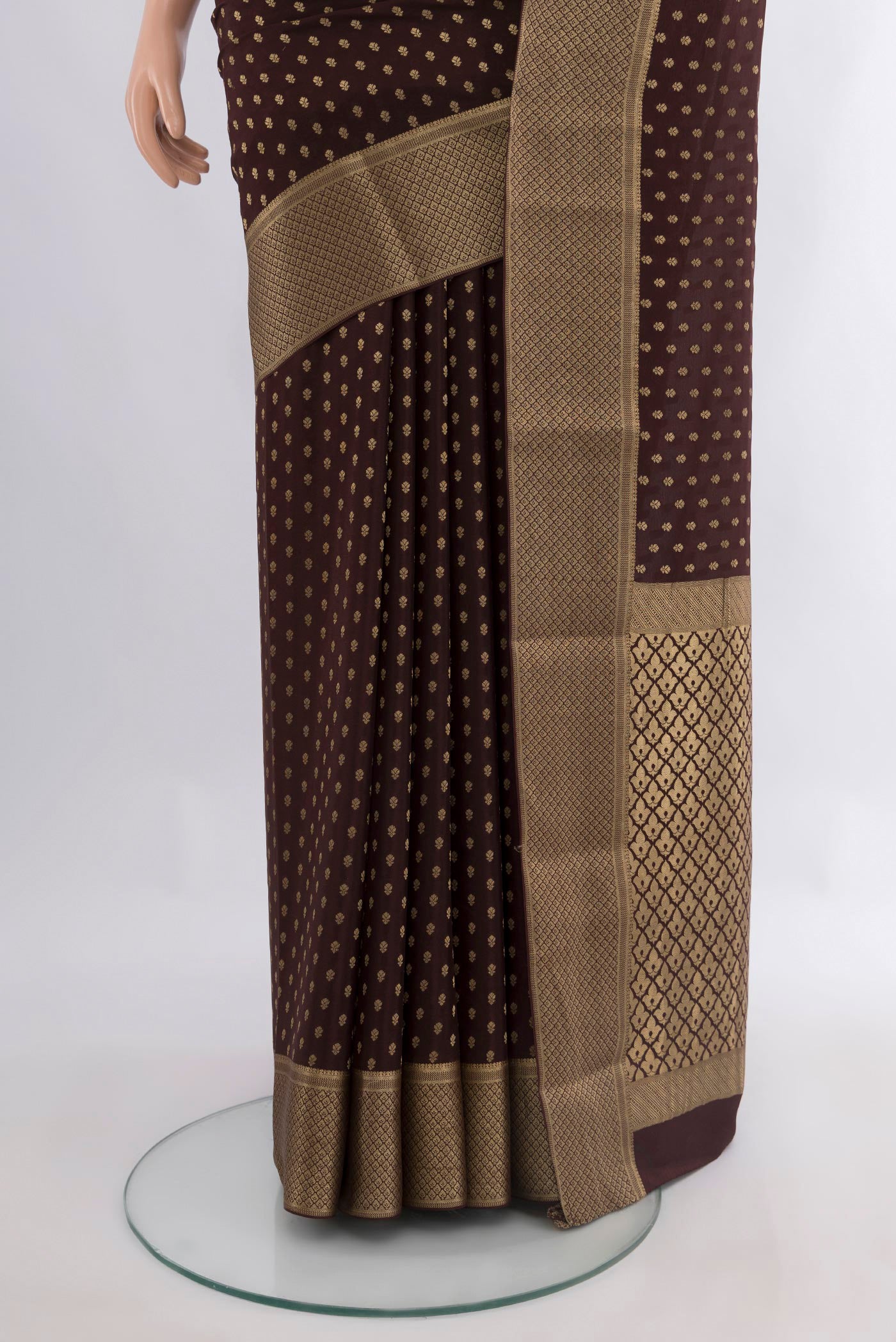 Pleats and pallu of Coffee Brown Mysore Crepe Saree with Zari Butta on the body and Zari Border. 