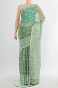 Pista Green Tussar Saree with Thread Butta on the body and Thread Border.  displayed on a mannequin
