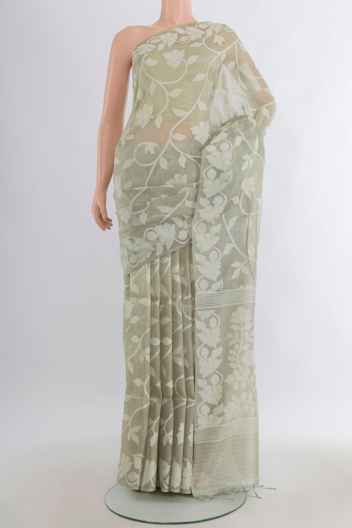 Light Green Tussar Saree with Jamdani on the body and Thread Border.  displayed on a mannequin