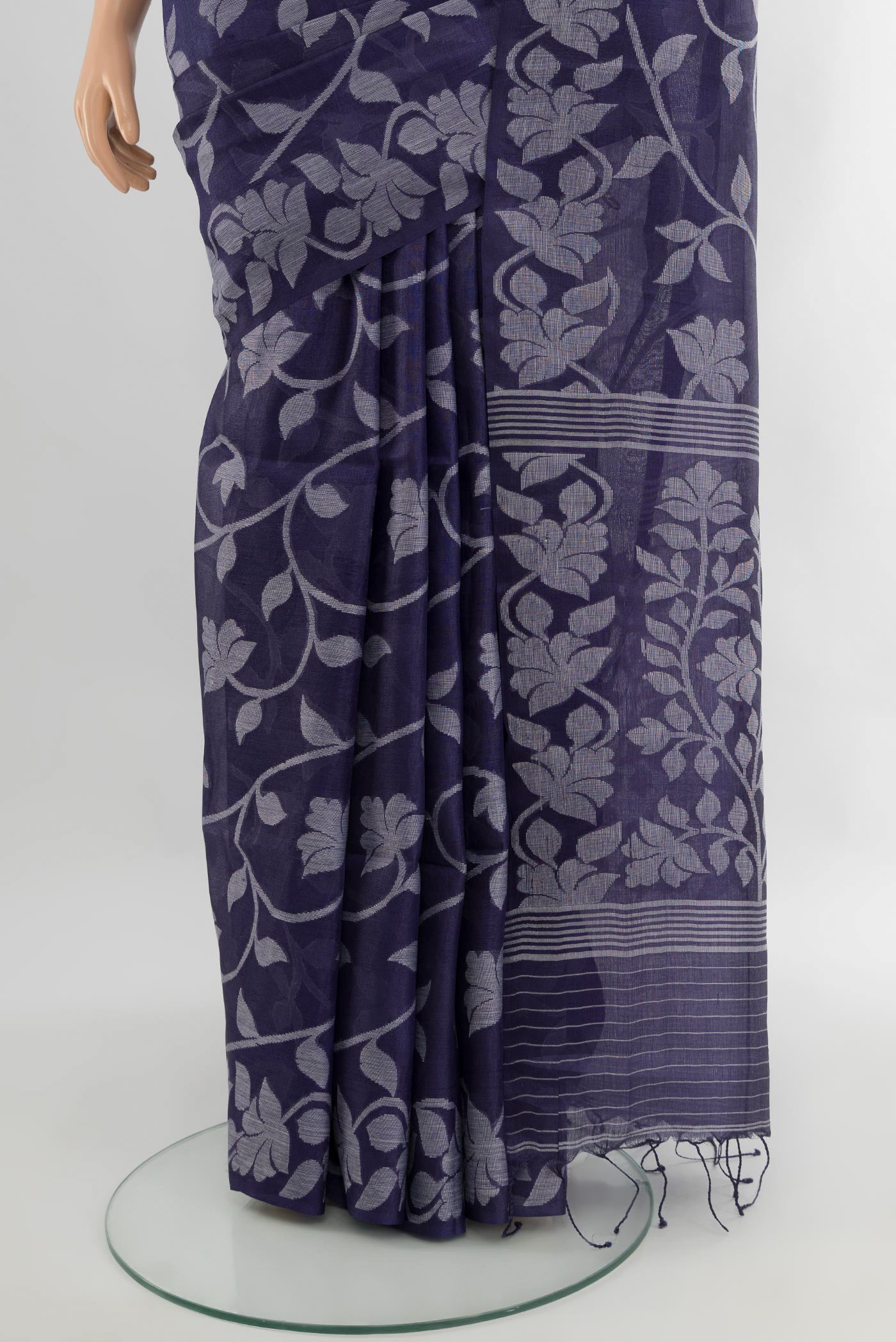 Pleats and pallu of Violet Bengal Cotton - Tangail Saree with Floral Print on the body and Thread Border. 