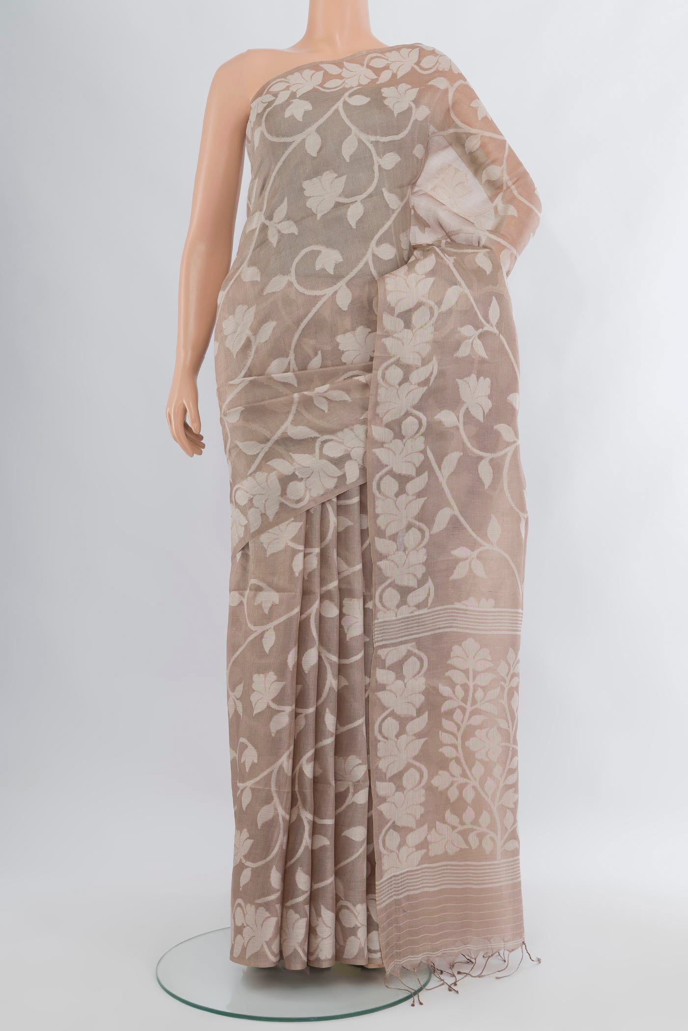 Beige Bengal Cotton - Tangail Saree with Floral Print on the body and Thread Border.  displayed on a mannequin