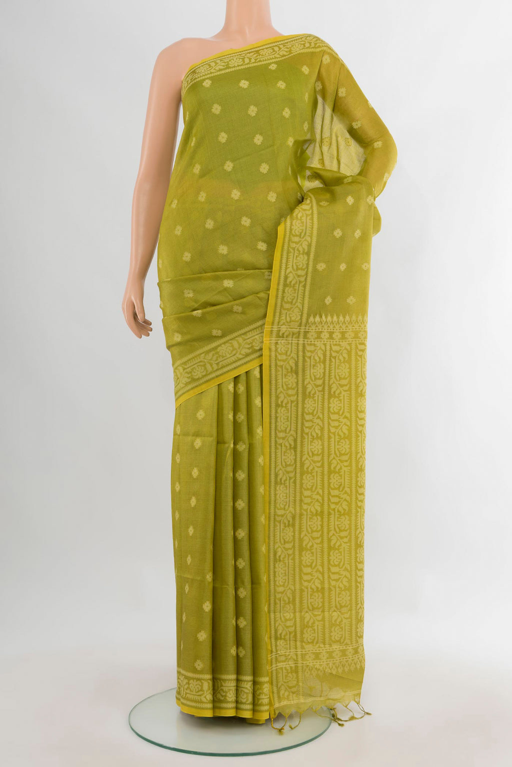 Light Green Tussar Saree with Thread Butta on the body and Thread Border.  displayed on a mannequin