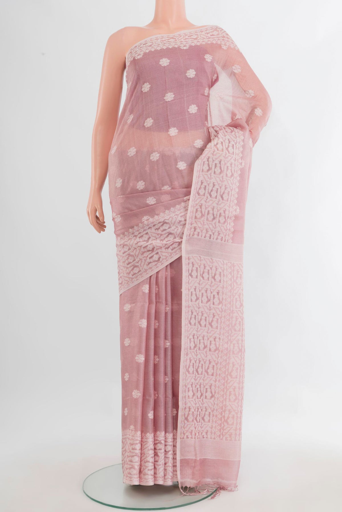 Rose pink Tussar Saree with Thread Butta on the body and Thread Border.  displayed on a mannequin