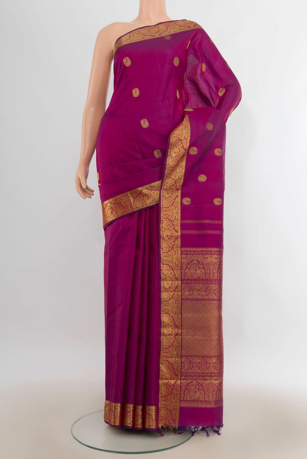Pure Silk Pure Zari Magenta Kanjivaram Saree with Zari Butta on the body and Zari Border.  displayed on a mannequin