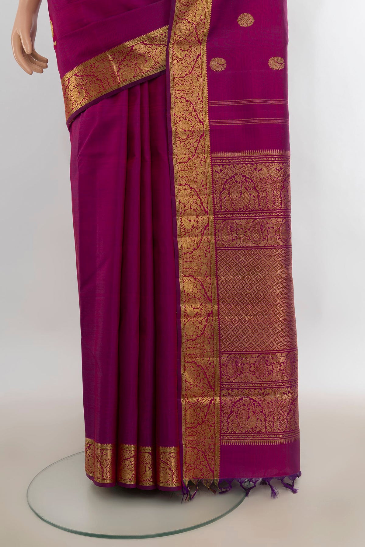 Pleats and pallu of Pure Silk Pure Zari Magenta Kanjivaram Saree with Zari Butta on the body and Zari Border. 
