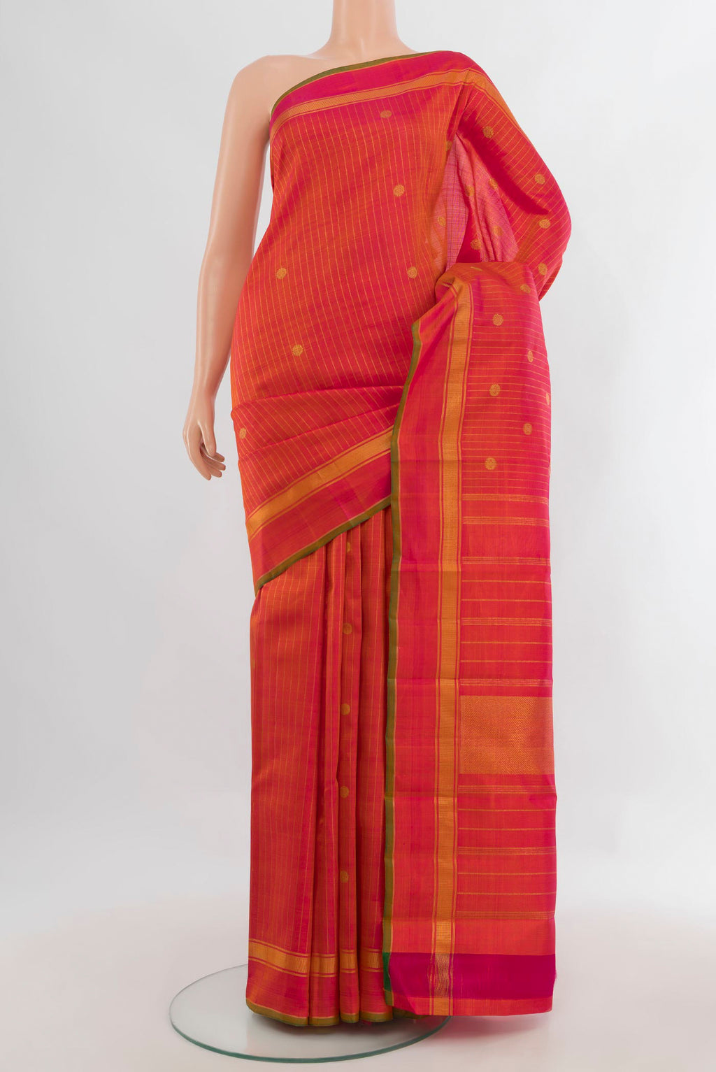 Pure Silk Pure Zari Brick Orange Kanchipuram Saree with Stripes on the body and Plain Border.  displayed on a mannequin