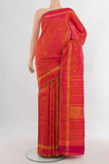 Pure Silk Pure Zari Brick Orange Kanchipuram Saree with Stripes on the body and Plain Border.  displayed on a mannequin