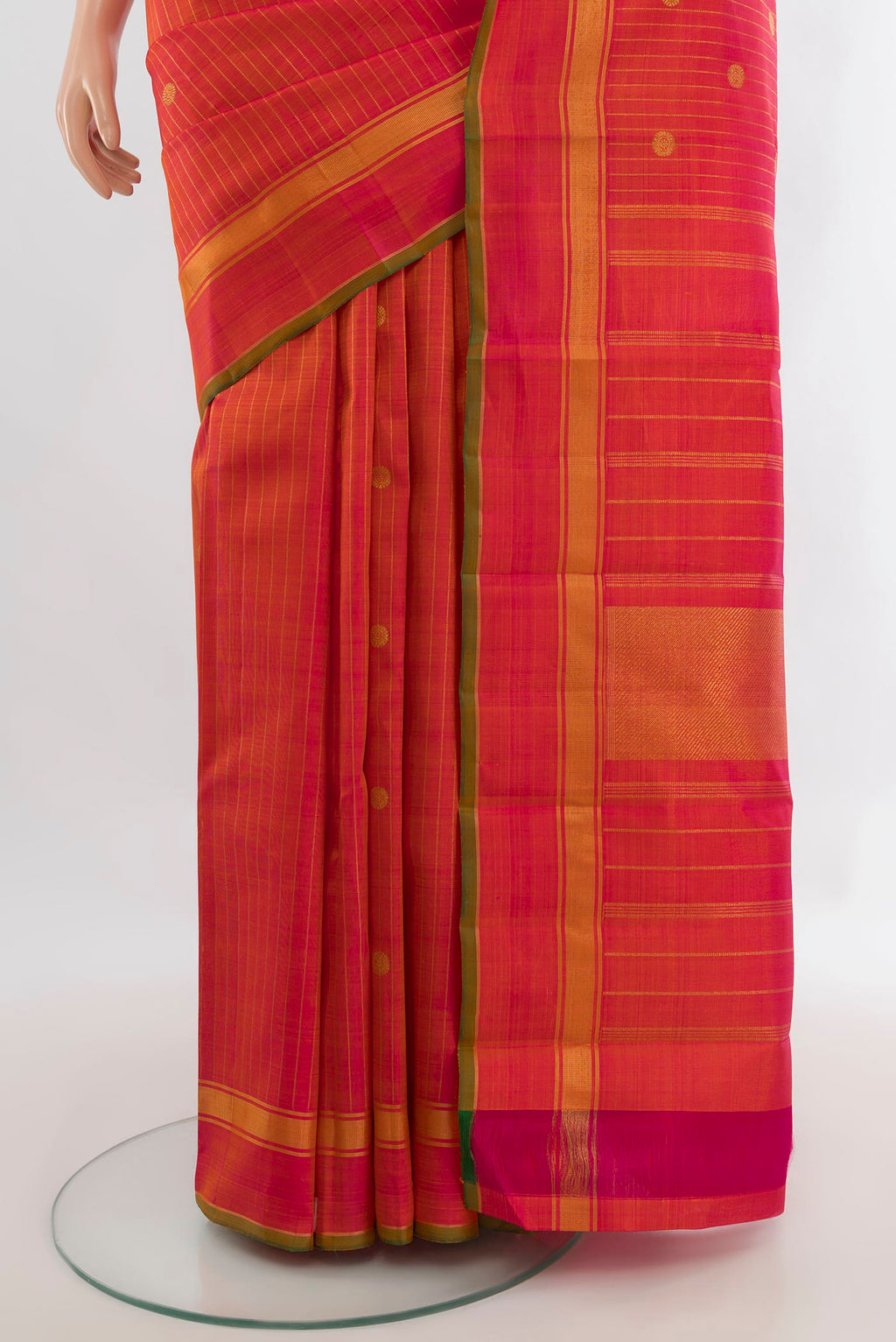 Pleats and pallu of Pure Silk Pure Zari Brick Orange Kanchipuram Saree with Stripes on the body and Plain Border. 