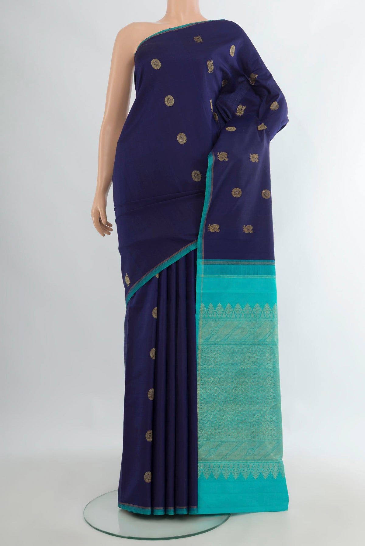 Pure Silk Pure Zari Navy Blue Kanchipuram Saree with Zari Butta on the body and Without Border.  displayed on a mannequin