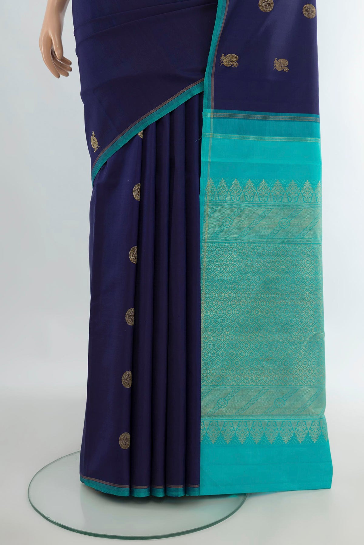 Pleats and pallu of Pure Silk Pure Zari Navy Blue Kanchipuram Saree with Zari Butta on the body and Without Border. 