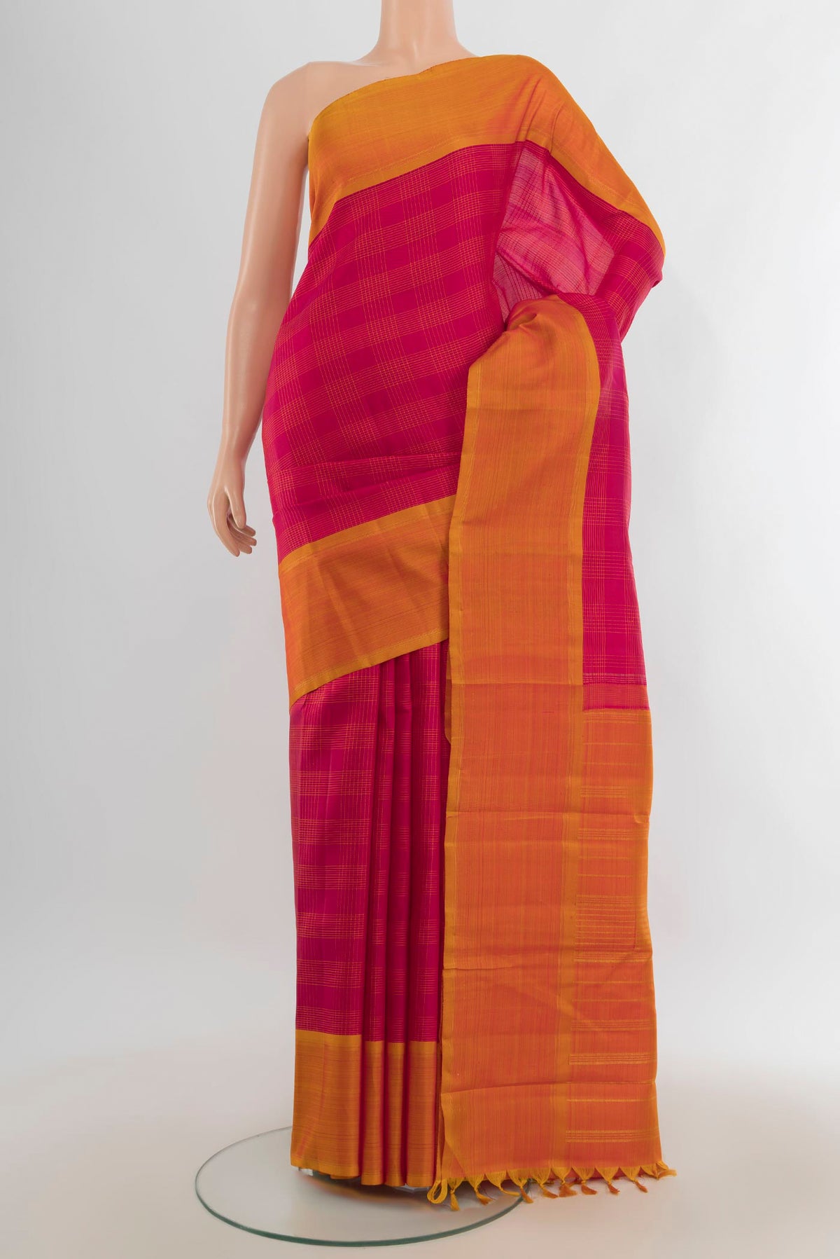 Pure Silk Pure Zari Dark Pink Kanchipuram Saree with Zari Butta on the body and Silk Border.  displayed on a mannequin