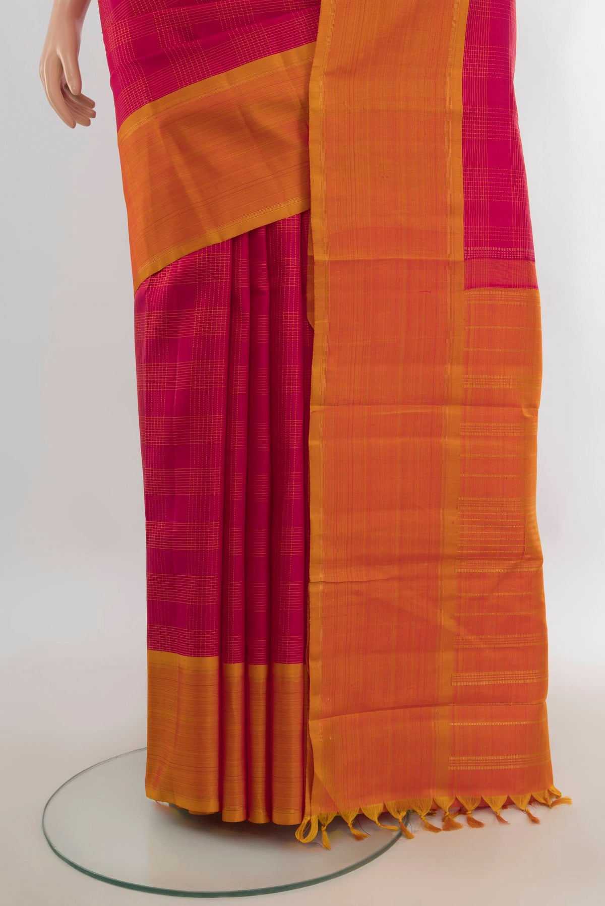 Pleats and pallu of Pure Silk Pure Zari Dark Pink Kanchipuram Saree with Zari Butta on the body and Silk Border. 
